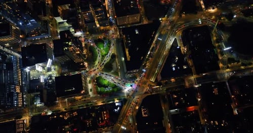 Gorgeous New York view from top. Numerous cars move by the lively roads of night city.