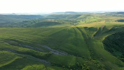 High Angle Aerial Above View of Green Meadow in the Spring, Countryside Hills