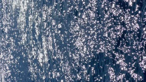 Shimmering Sunlight Reflecting on Ocean Waves