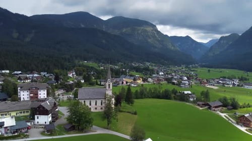 Amazing landscape of the Gosau village with beautiful evangelical church and mountains.