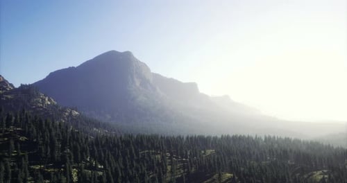 Majestic Mountain Range Under a Soft Morning Light in a Serene Landscape