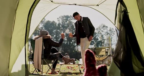 Coffee cup, camping and relax couple toast, bond and talk in nature forest