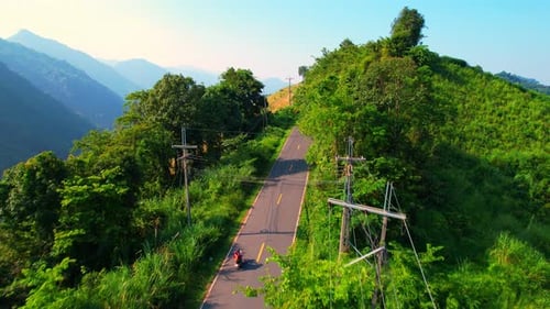 Drone is flying over "Loi Fah Road" during sunlight