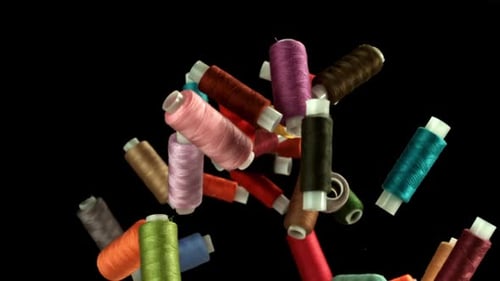 Multicolored Threads Fly on a Black Background Filmed on a Highspeed Camera at 1000 Fps