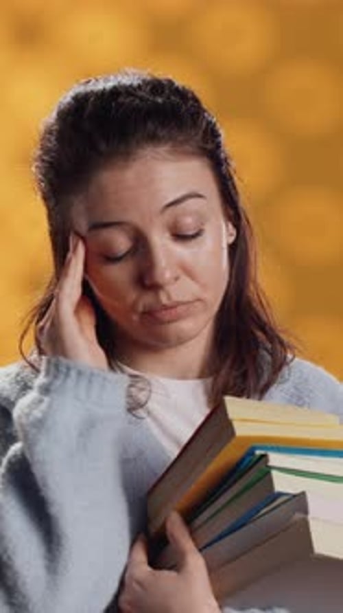 Vertical Video Woman Feeling Migraine Pain From Textbooks Needed for Homework