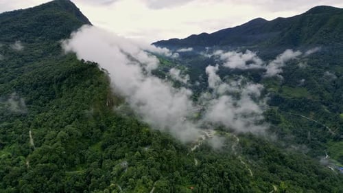 Green Mountain Valley Among Clouds in Nepal – Aerial Drone View