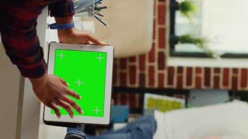 Tablet with Green Screen in Home Office