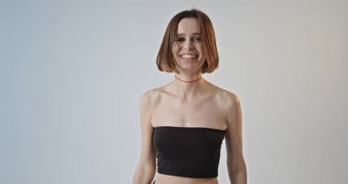 Happy Young Woman Shaking Hair