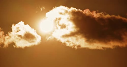 Golden Sky With Sun and Clouds at Sunrise