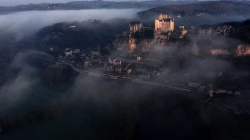 Foggy Village with Castle on Cliff Aerial View