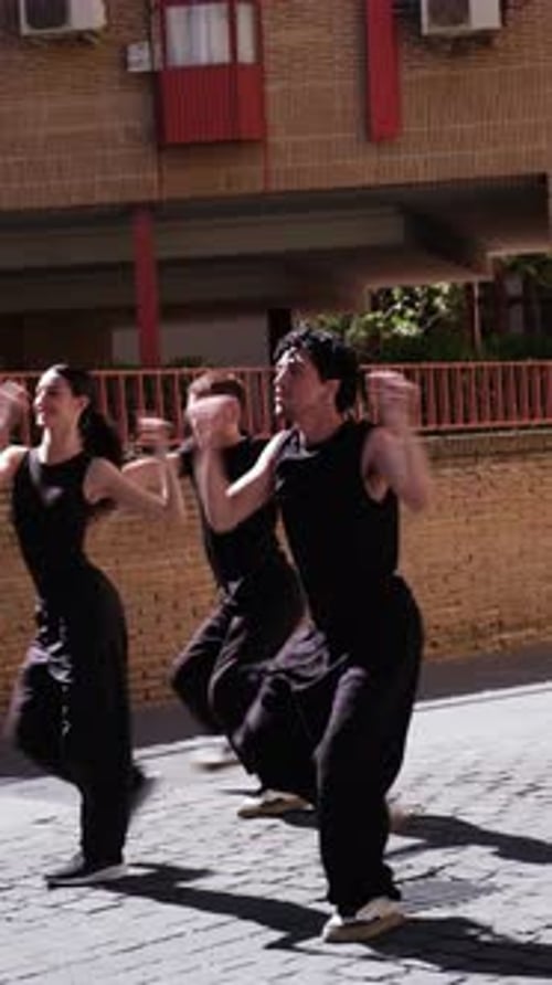 Group of professional street dancers performing modern choreography
