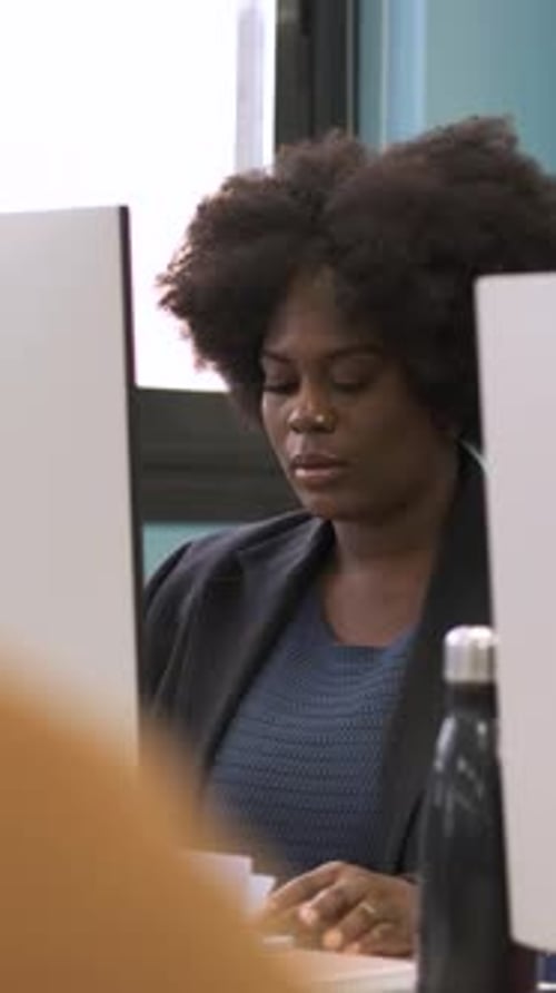 Focused Woman Working on Computer in Office