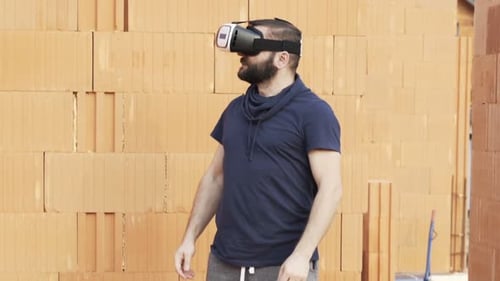 Man wearing VR headset in construction environment