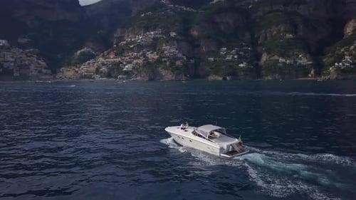 Beautiful boat ride along the stunning Amalfi coast in Italy during sunset