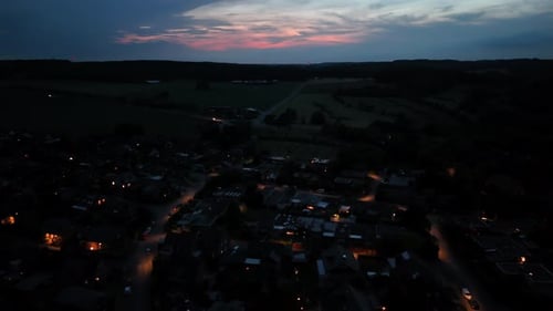 Town Lights Sparkle at Dusk From Above