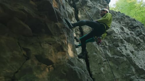 Young Bearded Guy Using Jumping Rope Moving Down Mountain Rock Climbing Active Climber Hiking in the