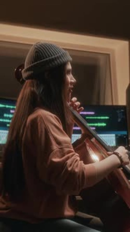 Girl Playing Cello in Recording Studio Side View Vertical Shot