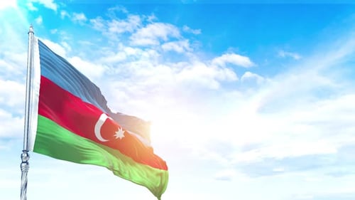 Azerbaijan Flag Waving Against Blue Sky