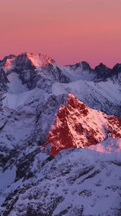 Majestic sunset over the snow-capped mountains of the Alps