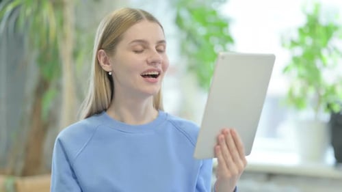 Blonde Woman Video Calling With Tablet Device