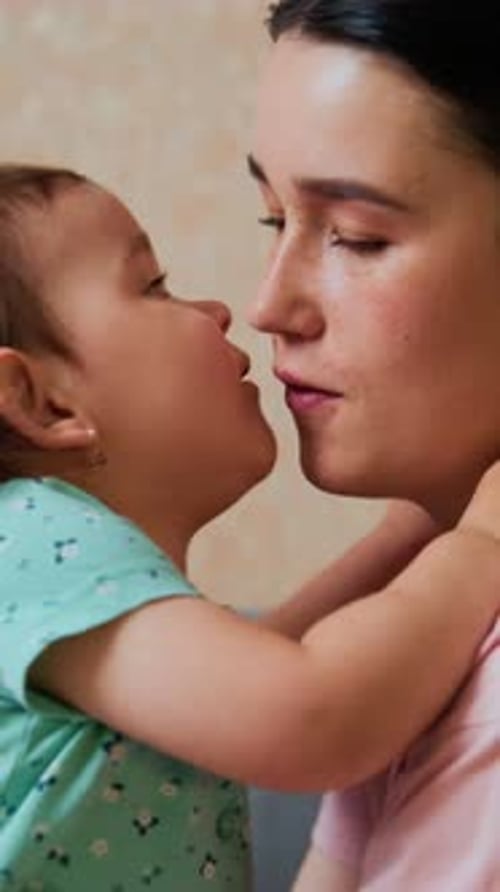 Child Cuddles with Gentle Affection Infant Lovingly Rests Head on Skin During Peaceful Sleep Moment