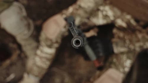 Close Up of Gun Barrel in Conflict Setting