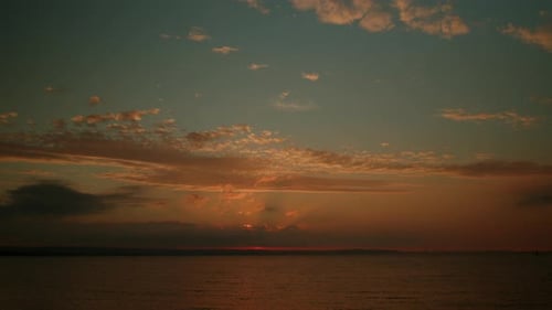 Tranquil Sunset Over the Calm Ocean