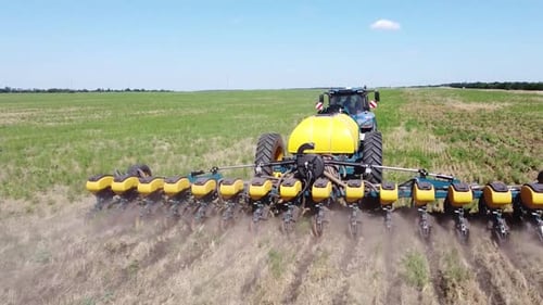 Blue Tractor O.A. Planting Canola On No Till Field