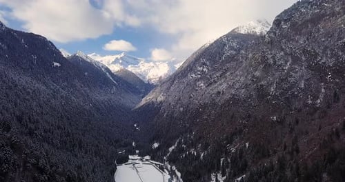 aerial view of snowy landscape trees in autumn and winter in the mountains with snow and beautiful