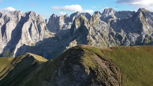 A Drone Flies Around a Beautiful Mountain Peak with the Epic Dinaric Alps in the Background
