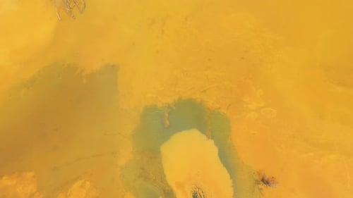 Aerial view of colorful natural water patterns. Mining water pollution, environmental pollution