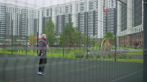 Youth Practicing Basketball Teenager Practicing Jump Shot at Urban Court Youth Engaged in Repeated