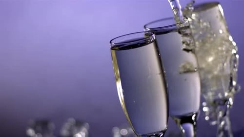 Champagne Flutes Filled with Bubbly Liquid