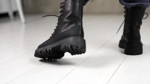 Person Wearing Black Fashionable Boots Close Up