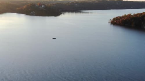 aerial view of lone fisherman on the lake