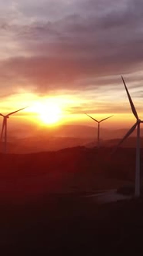 Wind Turbines Silhouetted at Stunning Sunrise, Rural Landscape