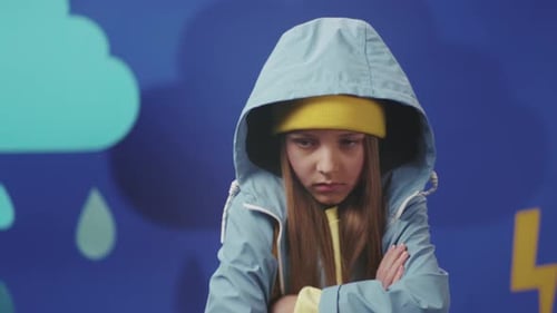 Youth in Hoodie Confronts Storm with Attitude Adolescent in Hood Exhibits Sulkiness Beside Lightning