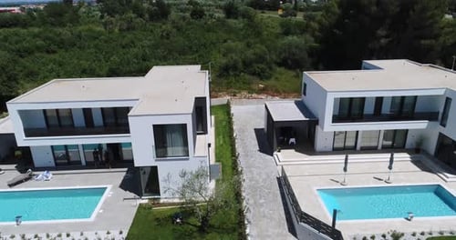 Aerial Drone Shot of Two Identical Vacation Homes or Villas with Sea View