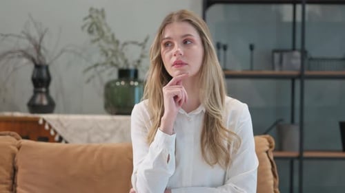Brainstorming Young Woman Thinking while at Home