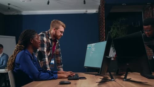 Data Engineering Team Work in Office Black Woman Programmer Writing Code Developing Database