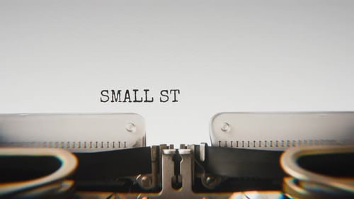 Old mechanical typewriter typing Small Steps Make Big Changes in a close-up view.