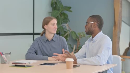 Young Business People Talking in Office