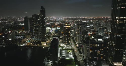 Miami Brickell in Florida USA Night Cityscape of Brightly Illuminated Shiny Skyscraper Buildings in