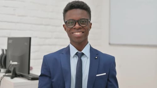 Smiling Young Adult Portrait in Business Setting