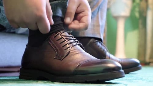 Close Up of Man Tying Dress Shoe Laces