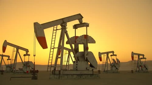 Oil Pumping Farm in Desert with Pipelines