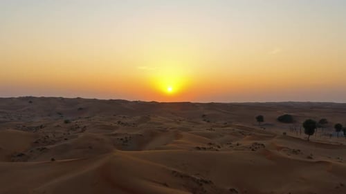 Drone View of Sunset Over Sand Dunes in Dubai Desert