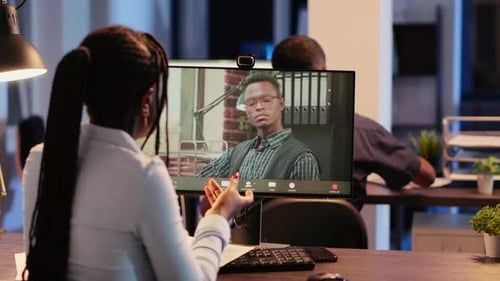 Business Woman Attending Videocall Online Meeting with Man