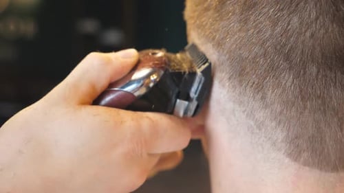 Close up Haircut with Electric Razor Indoors