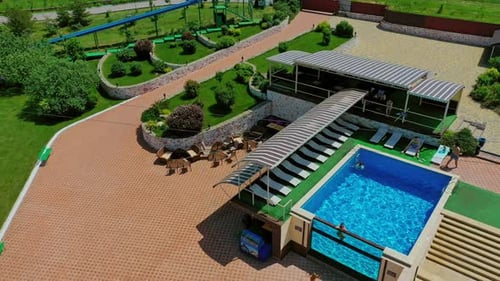 Swimming pool in recreation center. Modern territory for leisure activity in the countryside.
